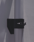 Telescope pole for outside antenna fastened to RV or building wall.
