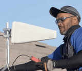 Installer will mount yagi antenna on j pole at the best signal spot on roof using signal meter.